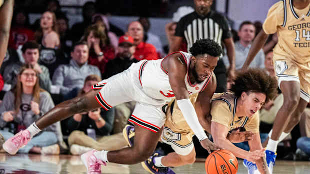 Dec 5, 2023; Athens, Georgia, USA; Georgia Bulldogs guard Noah Thomasson (3) and Georgia Tech Yellow Jackets guard Naithan George (2) dive for a ball on the floor during the second half at Stegeman Coliseum. Mandatory Credit: Dale Zanine-USA TODAY Sports  